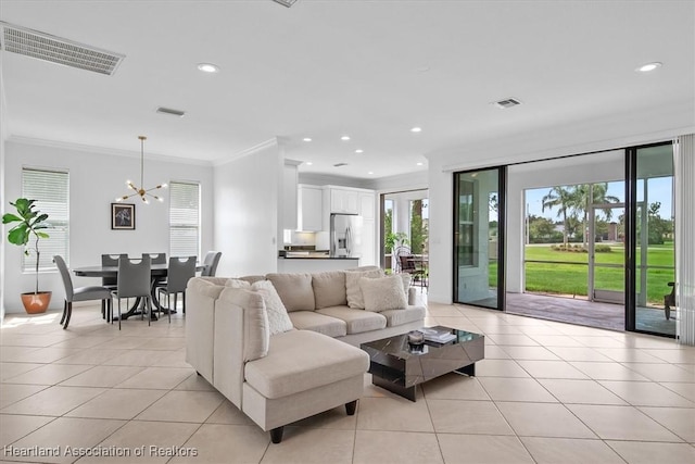 6831 Sun Blvd N, Sebring, FL 33872 - living area featuring light tile patterned floors, ornamental molding, a chandelier, and recessed lighting