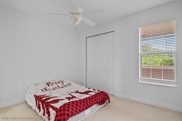6831 Sun Blvd N, Sebring, FL 33872 - carpeted bedroom featuring a closet, baseboards, and ceiling fan