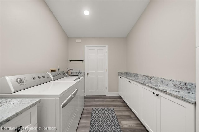 2 Chickasaw St, Lake Placid, FL 33852 - clothes washing area with baseboards, dark wood finished floors, cabinet space, independent washer and dryer, and a sink
