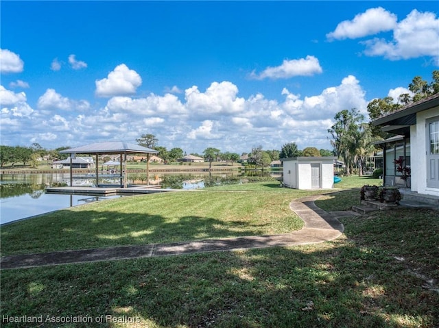 2 Chickasaw St, Lake Placid, FL 33852 - view of yard with a storage shed, an outdoor structure, and a water view