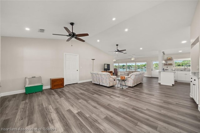 2 Chickasaw St, Lake Placid, FL 33852 - unfurnished living room with visible vents, wood finished floors, ceiling fan, and vaulted ceiling
