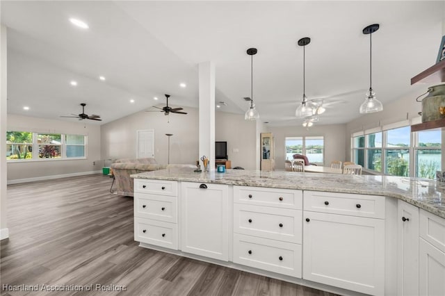 2 Chickasaw St, Lake Placid, FL 33852 - kitchen with decorative light fixtures, open floor plan, white cabinets, and a ceiling fan