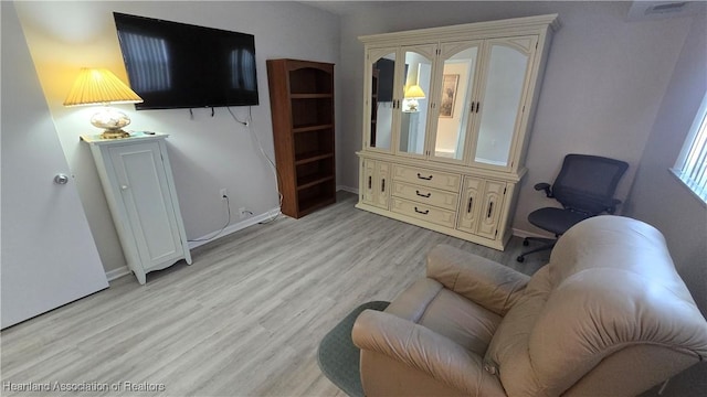 living area featuring light hardwood / wood-style floors