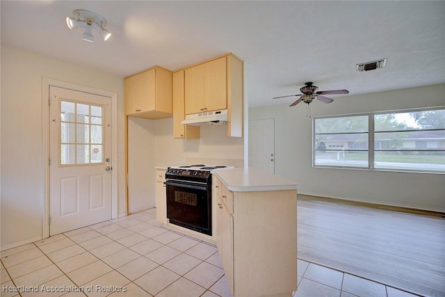 kitchen with visible vents, light tile patterned flooring, light countertops, black range with electric stovetop, and under cabinet range hood