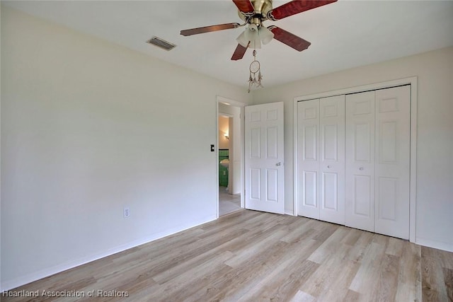 unfurnished bedroom with a ceiling fan, baseboards, visible vents, a closet, and light wood-type flooring