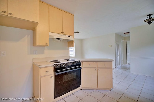 kitchen with light tile patterned floors, a peninsula, light countertops, under cabinet range hood, and black electric range oven