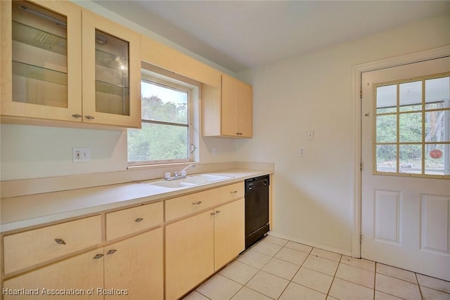 kitchen featuring light brown cabinetry, a sink, light tile patterned flooring, light countertops, and dishwasher