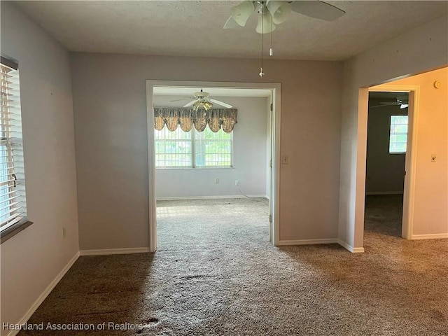 2527 Davis Cir, Sebring, FL 33870 - carpeted spare room featuring ceiling fan, healthy amount of natural light, and baseboards