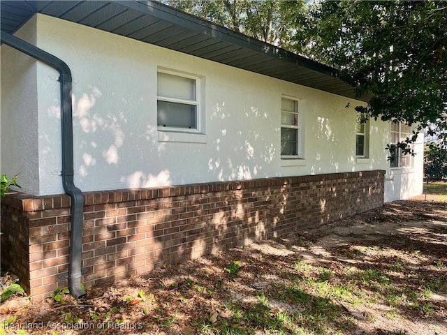 2527 Davis Cir, Sebring, FL 33870 - view of home's exterior with stucco siding and brick siding