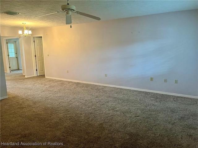 2527 Davis Cir, Sebring, FL 33870 - unfurnished room featuring a chandelier, carpet floors, a ceiling fan, baseboards, and a textured ceiling