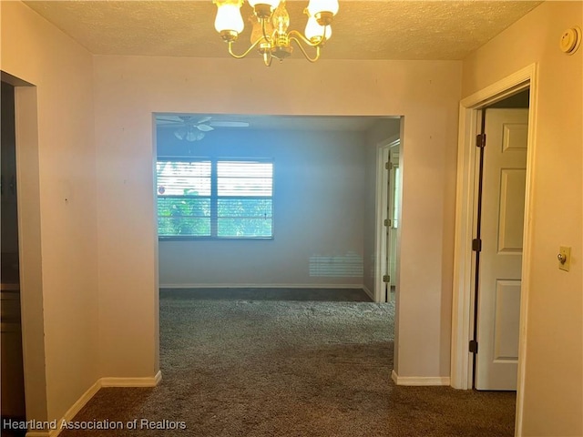 2527 Davis Cir, Sebring, FL 33870 - hall featuring a textured ceiling, carpet, a chandelier, and baseboards