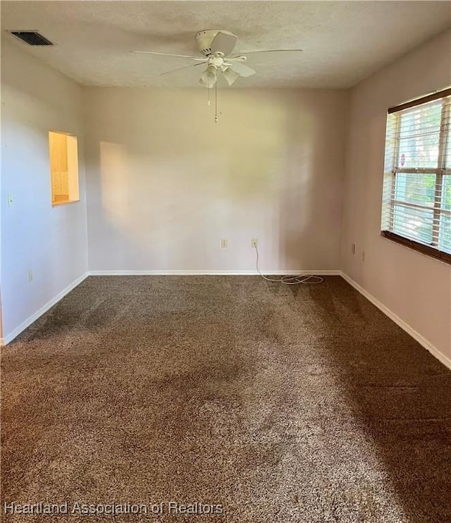 2527 Davis Cir, Sebring, FL 33870 - empty room featuring ceiling fan, carpet flooring, and baseboards