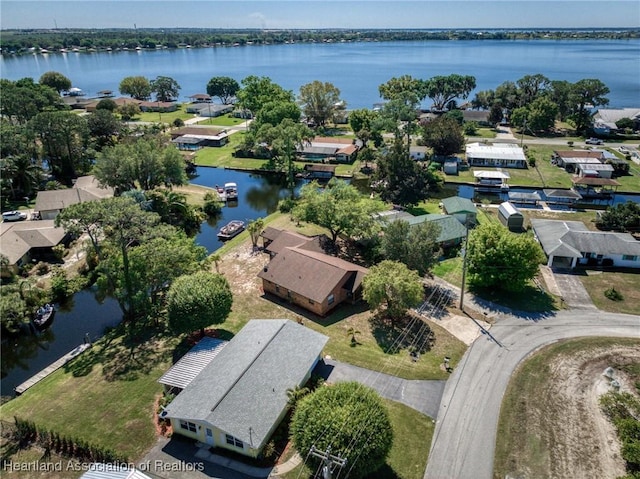 drone / aerial view with a water view and a residential view