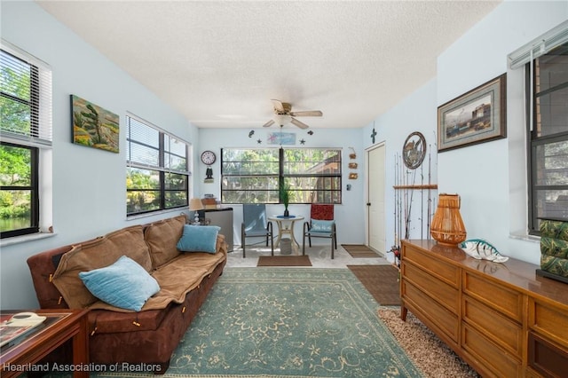 sunroom with a ceiling fan