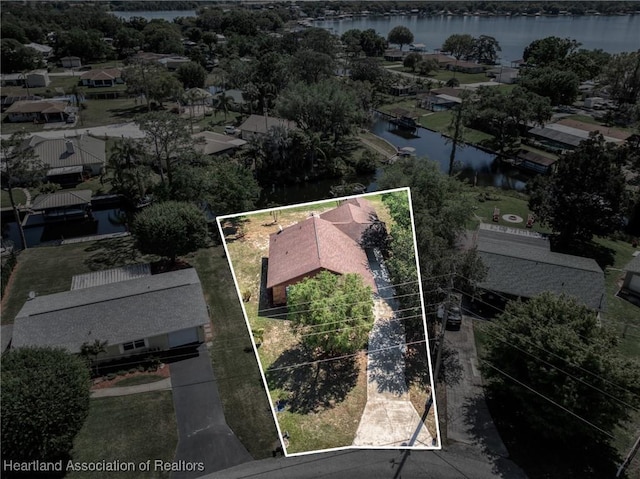 birds eye view of property featuring a water view