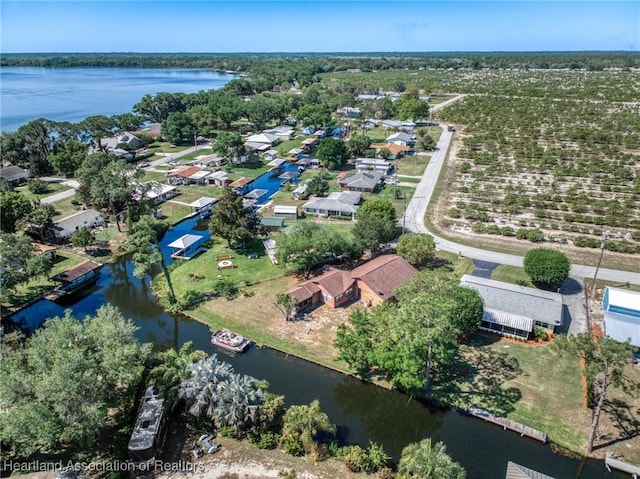 birds eye view of property featuring a water view and a residential view