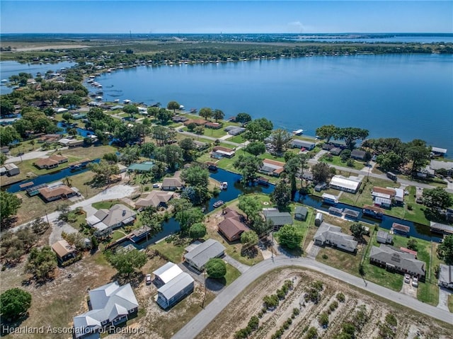 aerial view featuring a residential view and a water view