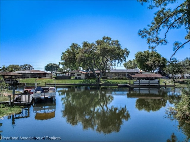 property view of water with boat lift and a dock