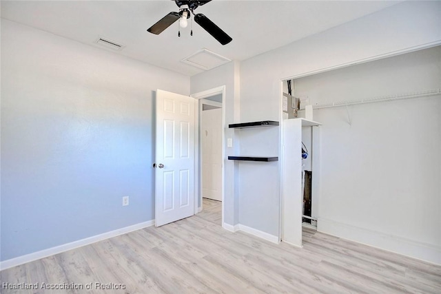 unfurnished bedroom featuring a closet, light hardwood / wood-style flooring, and ceiling fan