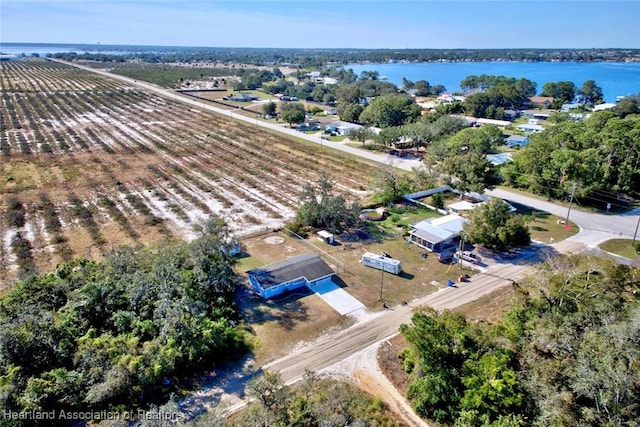 drone / aerial view with a rural view and a water view