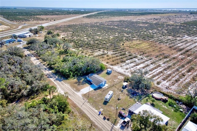 birds eye view of property with a rural view