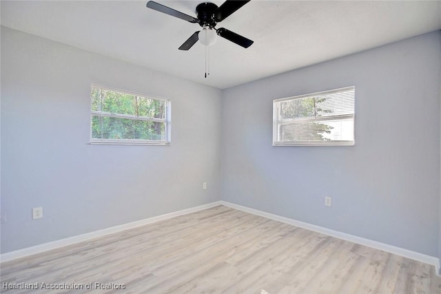 unfurnished room featuring ceiling fan and light wood-type flooring