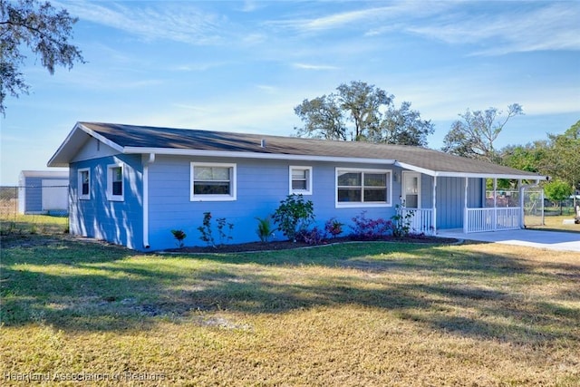 ranch-style house with a front lawn and covered porch