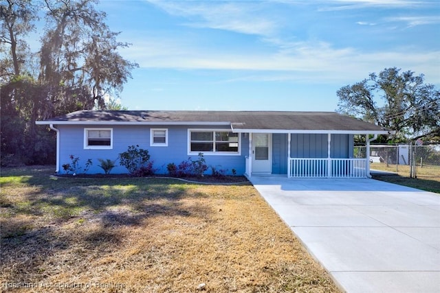 single story home featuring a porch and a front yard