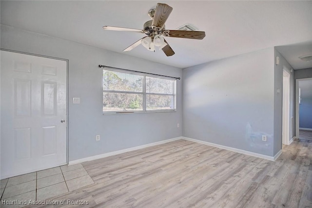 spare room with ceiling fan and light hardwood / wood-style floors