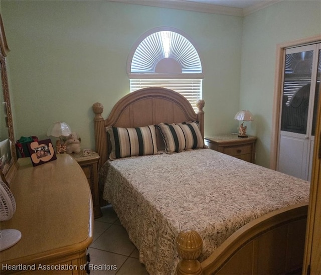 bedroom featuring crown molding and light tile patterned floors