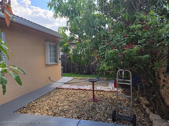 view of yard featuring a patio area and fence