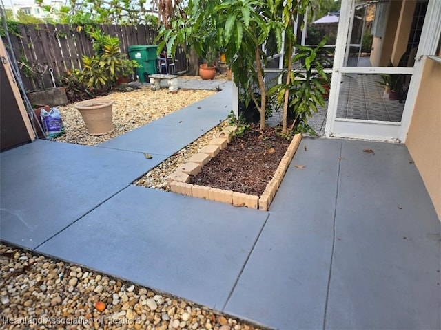 view of patio / terrace featuring fence