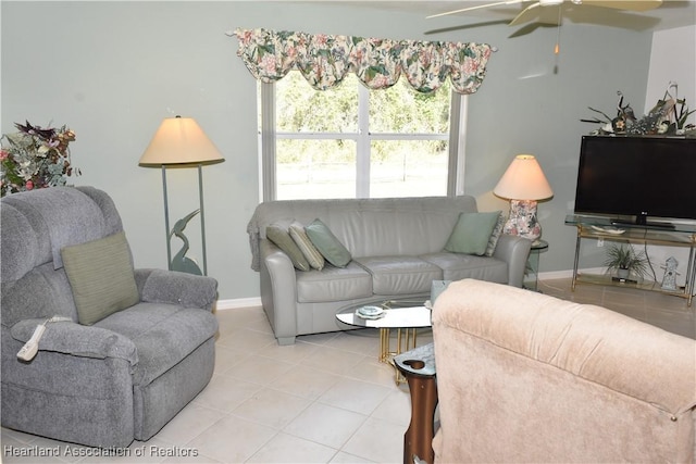 3603 Herring Ave, Sebring, FL 33870 - living room with light tile patterned floors, baseboards, and a ceiling fan