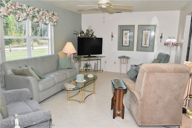 3603 Herring Ave, Sebring, FL 33870 - living area with light tile patterned floors and a ceiling fan