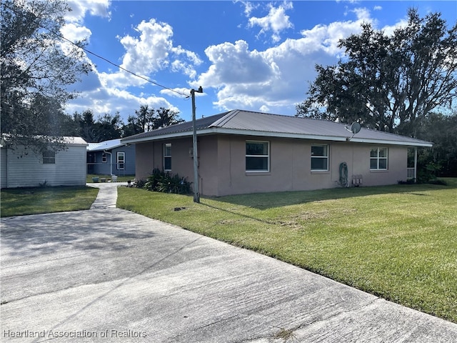 3603 Herring Ave, Sebring, FL 33870 - view of front of house with stucco siding and a front yard