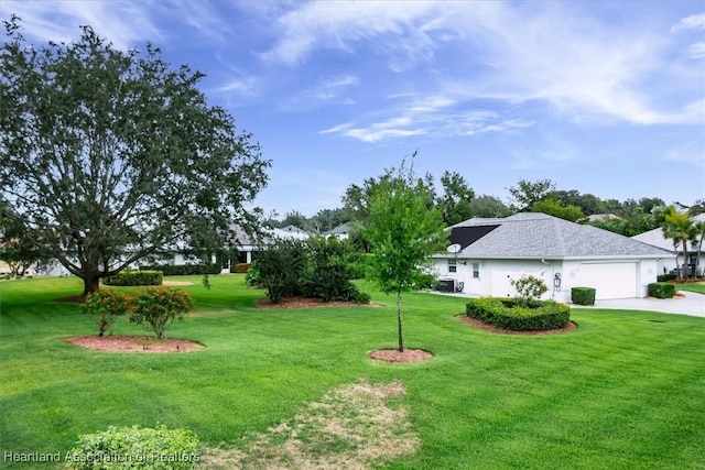 view of yard featuring a garage