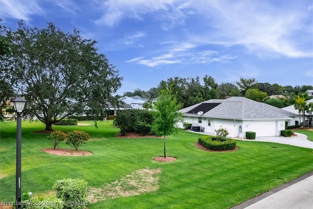 view of yard featuring a garage