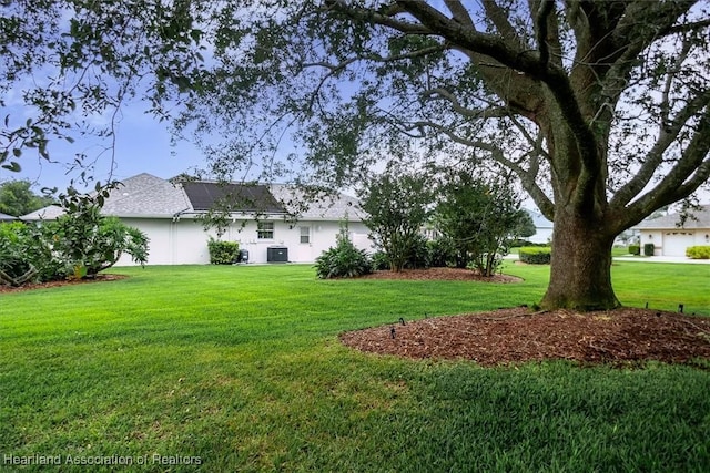 view of yard with central AC