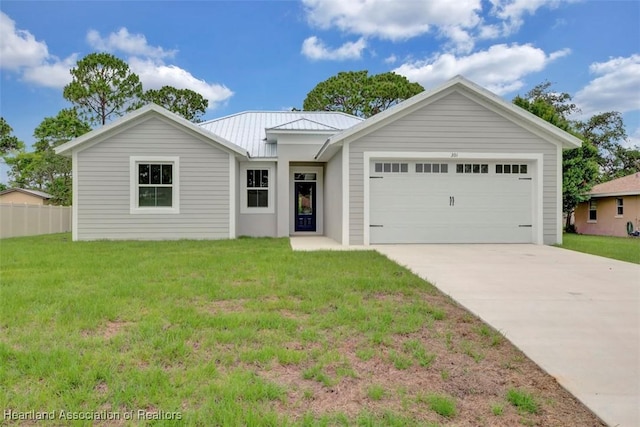 ranch-style home featuring a front lawn and a garage