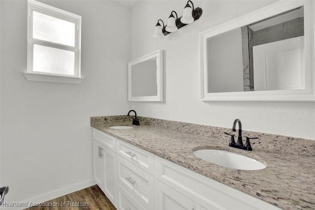 bathroom featuring vanity and hardwood / wood-style flooring