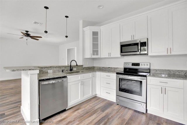 kitchen featuring sink, white cabinetry, and stainless steel appliances