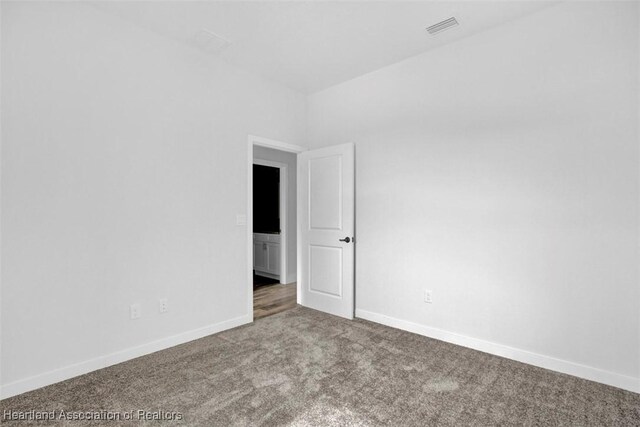 unfurnished room featuring carpet flooring