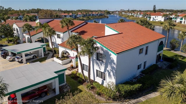 birds eye view of property featuring a water view