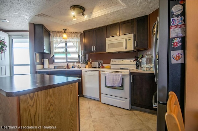 kitchen with white appliances, a textured ceiling, a raised ceiling, light tile patterned floors, and dark brown cabinets