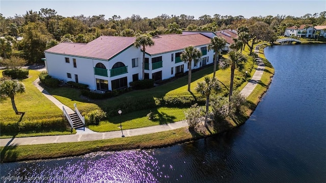 birds eye view of property featuring a water view