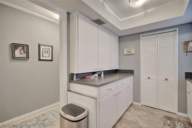 washroom featuring ornamental molding and light tile patterned flooring