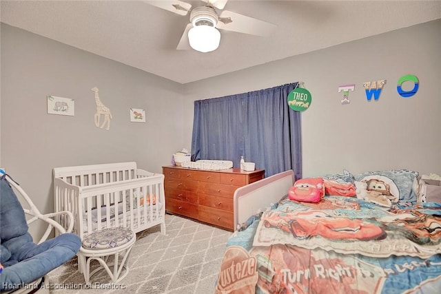 carpeted bedroom featuring ceiling fan