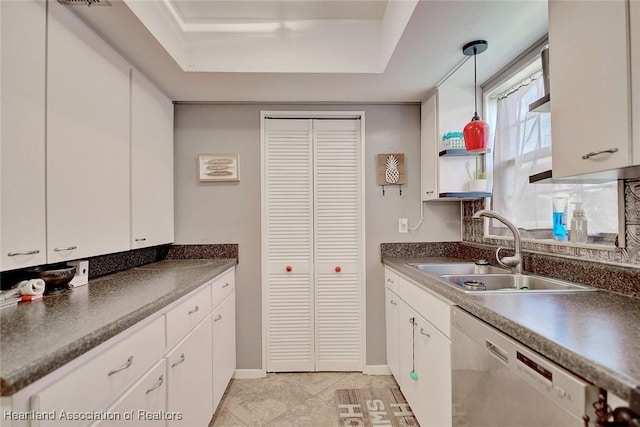 kitchen with white cabinets, decorative light fixtures, and dishwasher