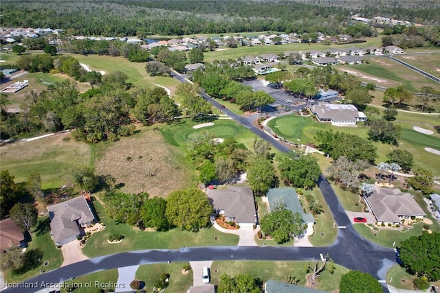 drone / aerial view featuring a residential view and golf course view