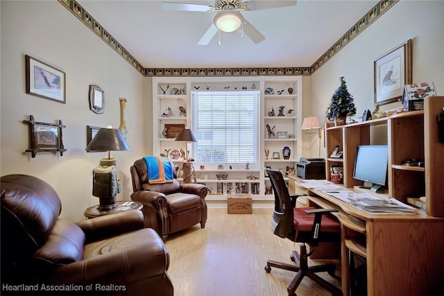 home office featuring a ceiling fan and wood finished floors